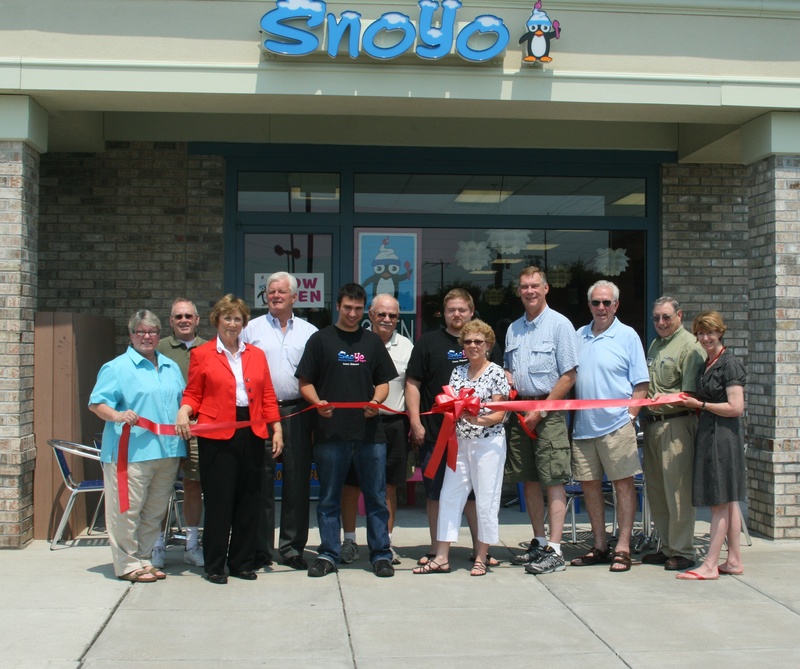 Shown at the SnoYo ribbon-cutting are (l-r) Kathy Davison, Comcast/Spotlight; Fred Beaufait, Lewes City Councilman; Joan Deaver, Sussex County councilwoman; Ted Becker, Lewes City councilman; Bradley Moogalian, SnoYo manager; Bob Peck, Peck Construction, project manager; Michael Friedhaber, SnoYo manager; Karen and Marc Friedhaber, co-owners; Victor Letenoff, Lewes City councilman; Orville Mills, Lewes Chamber of Commerce board member; and Betsy Reamer, Lewes Chamber of Commerce executive director. BY HENRY J. EVANS JR.
